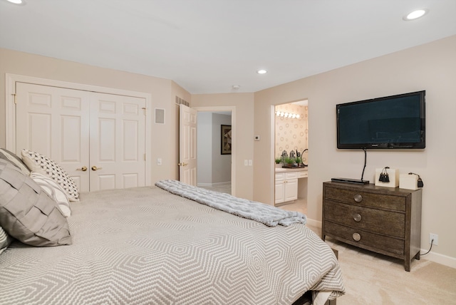 carpeted bedroom with ensuite bathroom