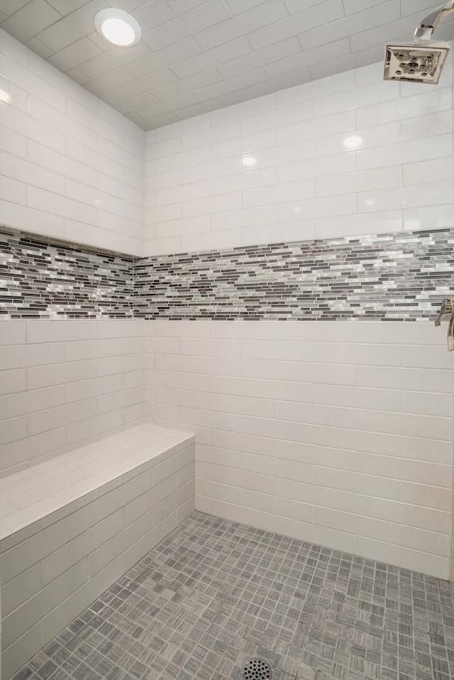 bathroom with tiled shower