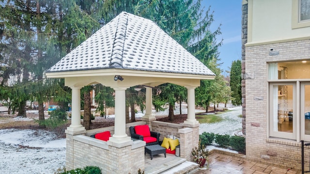 view of property's community with a gazebo and outdoor lounge area