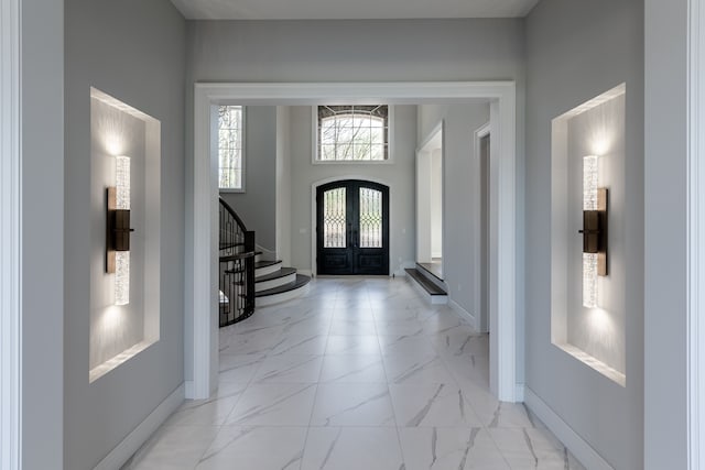 foyer entrance featuring french doors