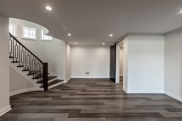 4380 The Heights Blvd, Rochester, MI 48306 - basement with a barn door and dark wood-type flooring
