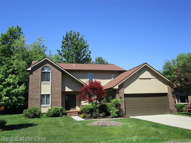 front facade featuring a front yard and a garage