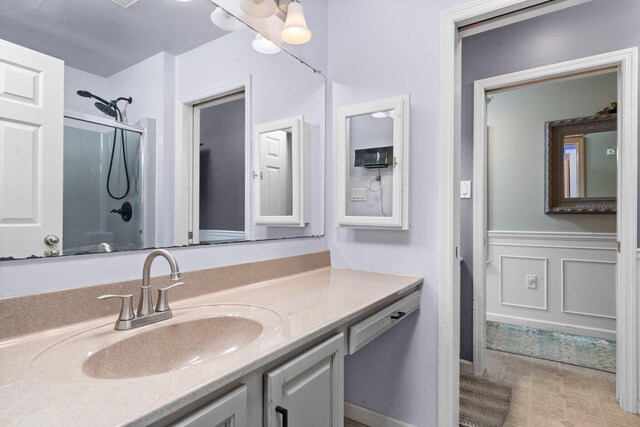 bathroom with vanity and an enclosed shower