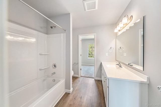 172 Woodland Way, Manchester, MI 48158 - bathroom with hardwood / wood-style floors, vanity, and bathing tub / shower combination