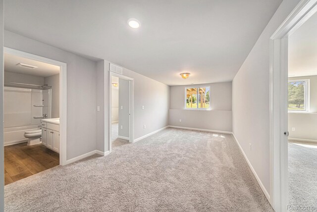 172 Woodland Way, Manchester, MI 48158 - unfurnished bedroom with carpet flooring and ensuite bathroom