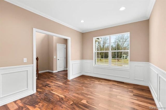 unfurnished room featuring dark hardwood / wood-style floors and ornamental molding