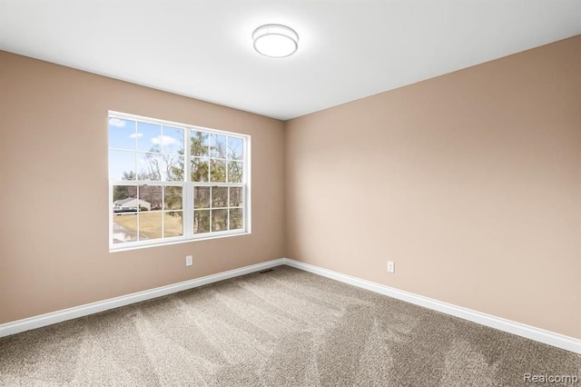 unfurnished room with carpet floors