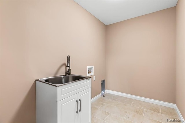 laundry room with sink, cabinets, and washer hookup