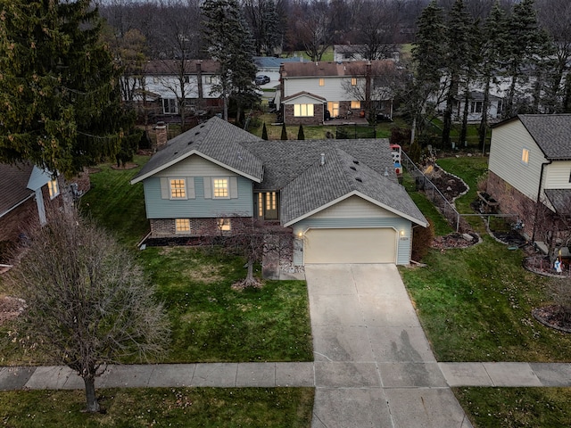 view of front facade with a front lawn and a garage