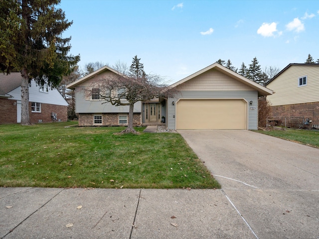 view of front of property featuring a garage and a front yard