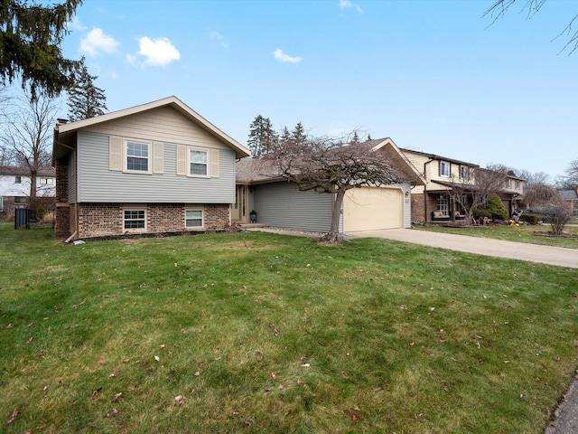 tri-level home with a garage and a front lawn