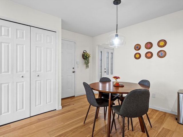 dining area with light hardwood / wood-style flooring