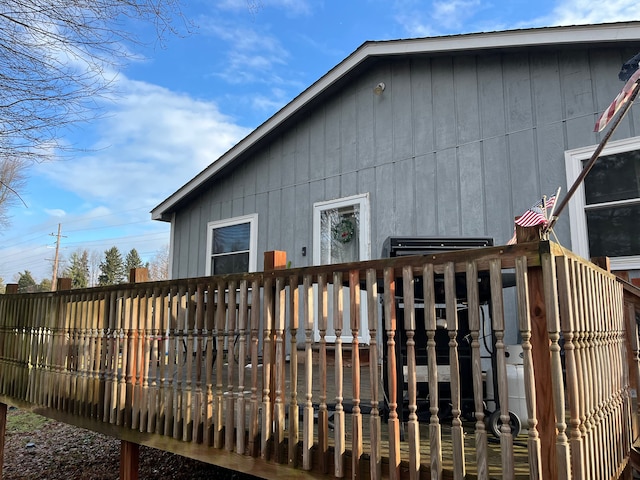 view of property exterior featuring a wooden deck