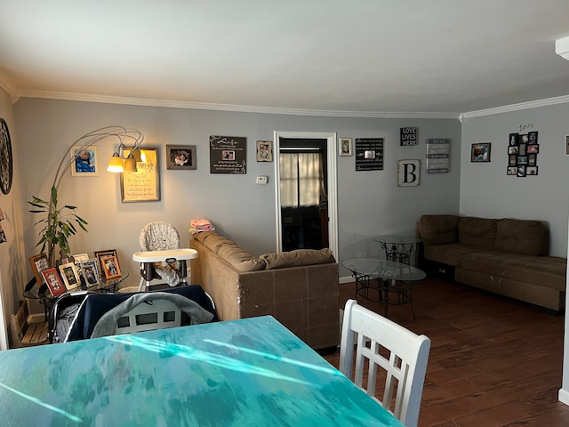 dining space featuring crown molding and dark hardwood / wood-style flooring