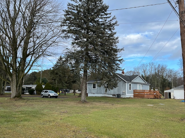 exterior space with a lawn and a deck