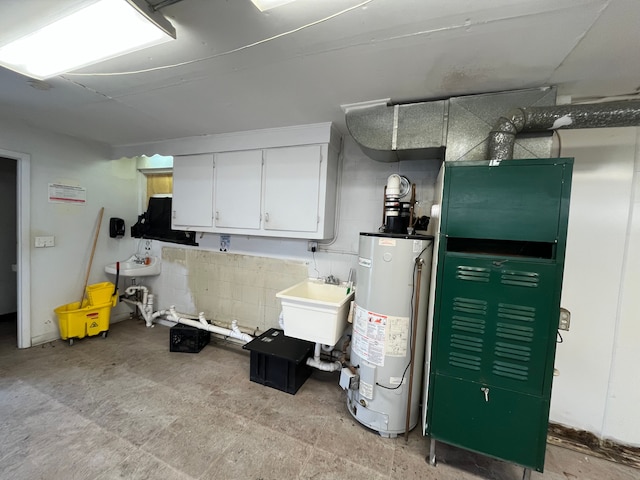 interior space with water heater, sink, and white cabinets