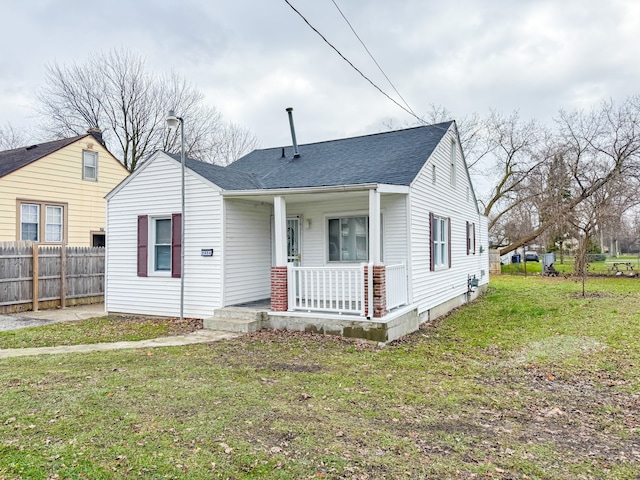 bungalow-style house with covered porch and a front yard