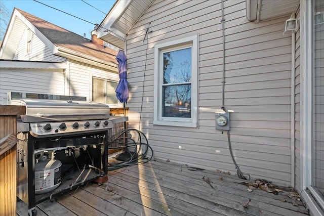 wooden deck featuring area for grilling