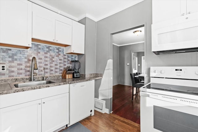 kitchen featuring dark hardwood / wood-style flooring, white cabinetry, sink, and white appliances