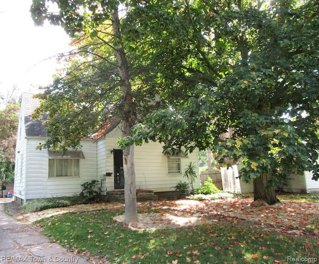 view of property hidden behind natural elements