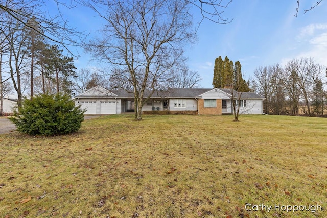 1193 N State Rd, Ionia, MI 48846 - single story home with a front yard and a garage