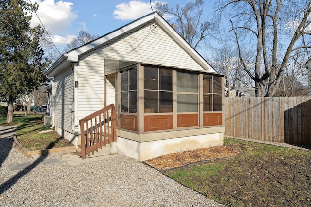 back of house with a sunroom