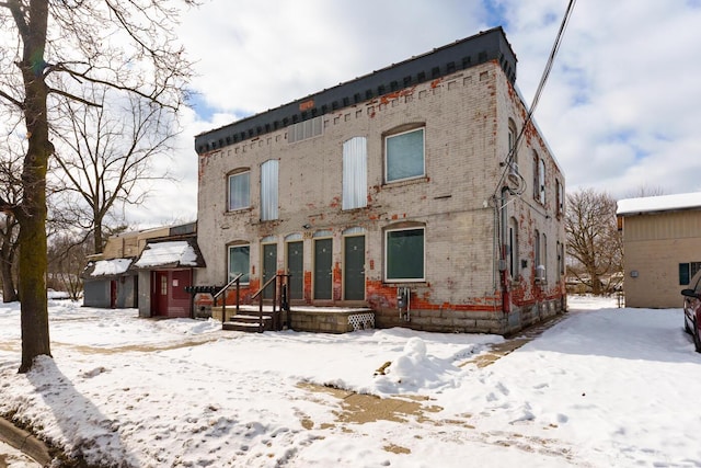 view of snow covered house