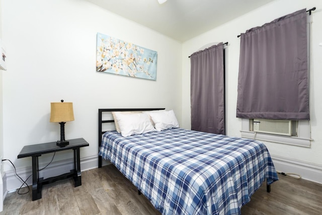 bedroom featuring dark hardwood / wood-style flooring