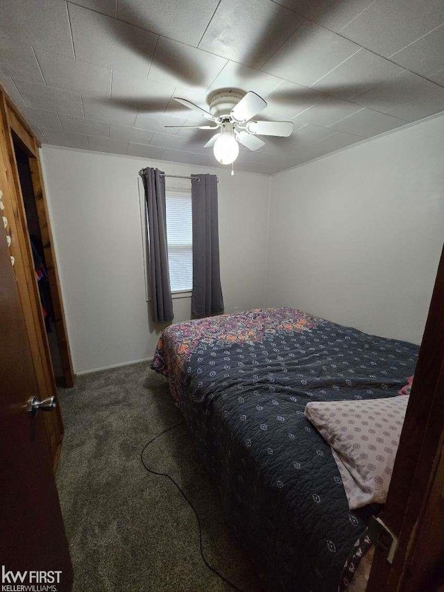 bedroom featuring ceiling fan and carpet floors