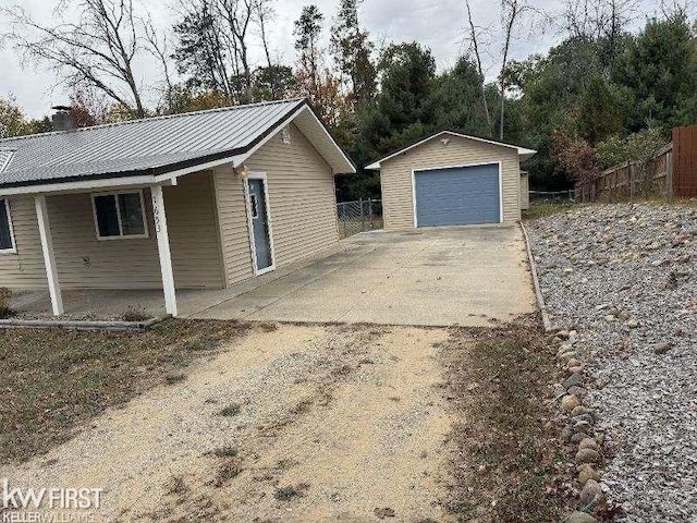 view of property exterior with an outbuilding and a garage