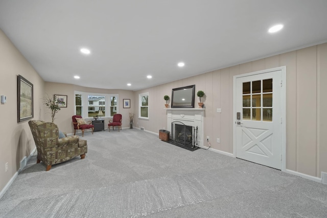 unfurnished living room with light colored carpet