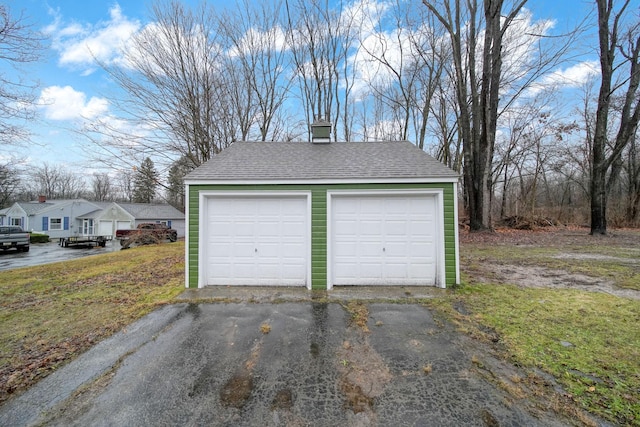 garage featuring a yard