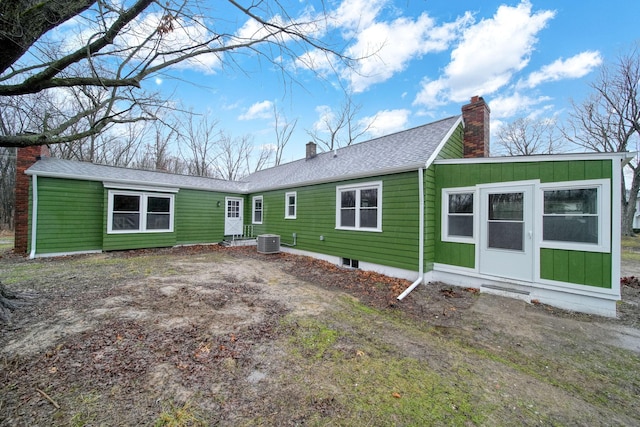 back of house featuring central AC unit