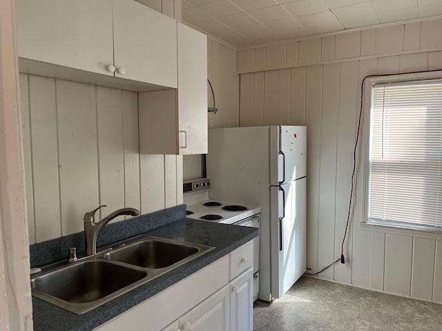 kitchen with white cabinetry, sink, white electric range oven, and plenty of natural light