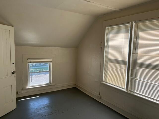 bonus room featuring vaulted ceiling