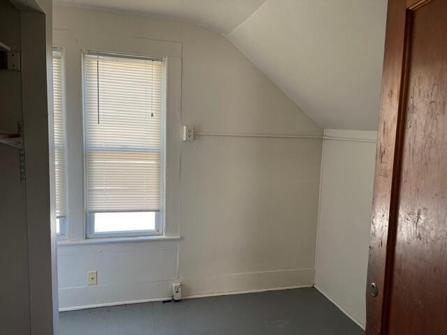 bonus room with vaulted ceiling and a healthy amount of sunlight