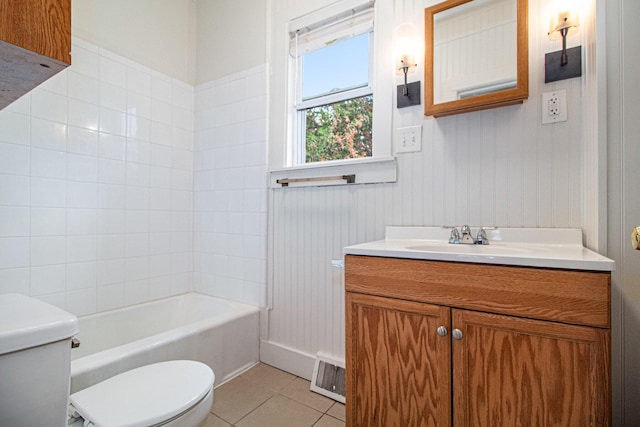 full bathroom with tile patterned flooring, vanity, toilet, and tiled shower / bath combo