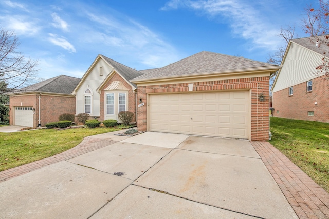 view of front of property with a garage and a front yard