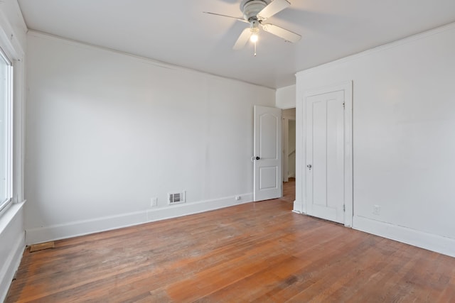 spare room featuring hardwood / wood-style flooring and ceiling fan