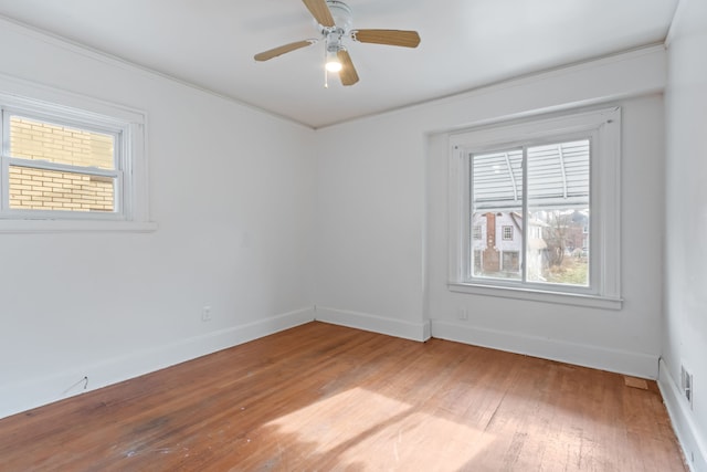 unfurnished room featuring crown molding, ceiling fan, and wood-type flooring