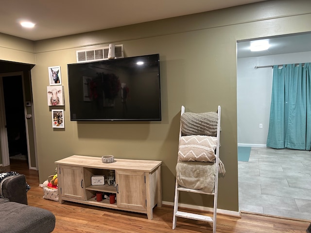 living room with light hardwood / wood-style floors