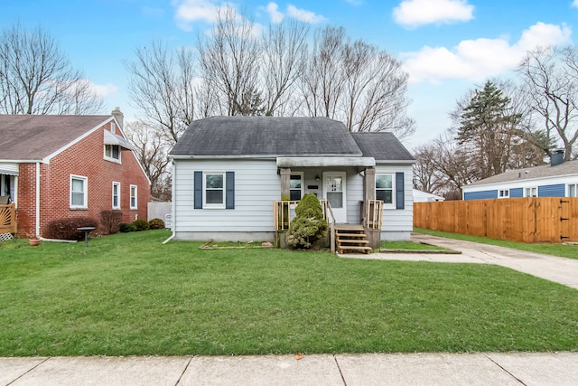 bungalow-style home with a front lawn