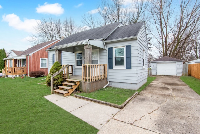 view of front of property featuring an outbuilding, a garage, and a front lawn