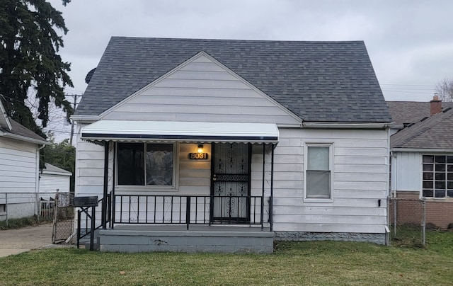 bungalow-style home with a front yard