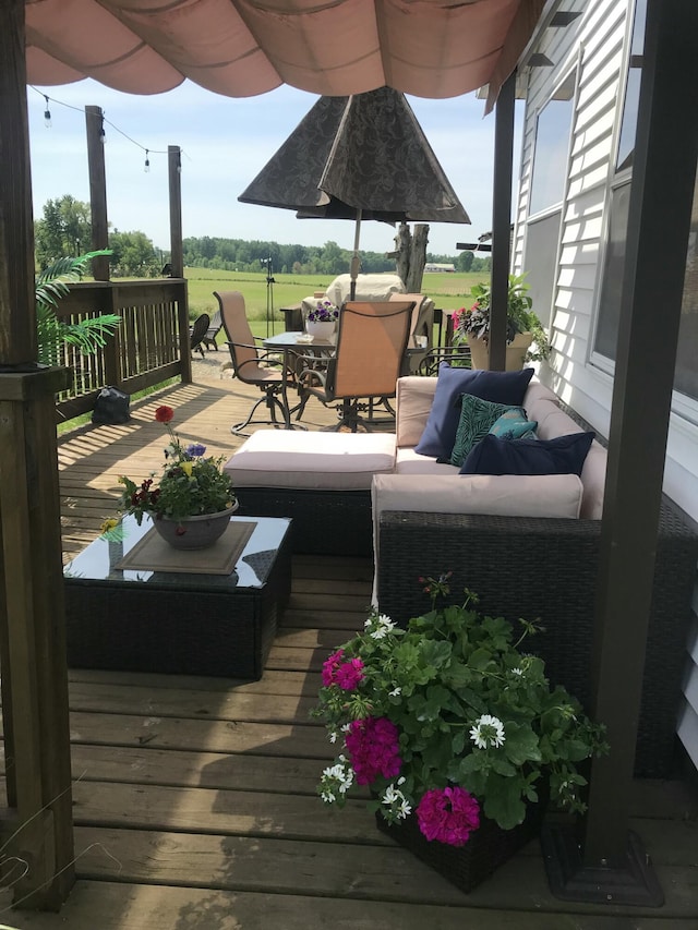 deck featuring outdoor lounge area