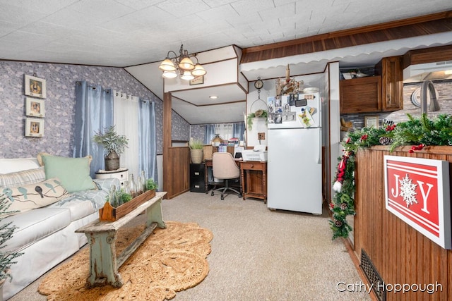 living room with lofted ceiling, light colored carpet, and a notable chandelier