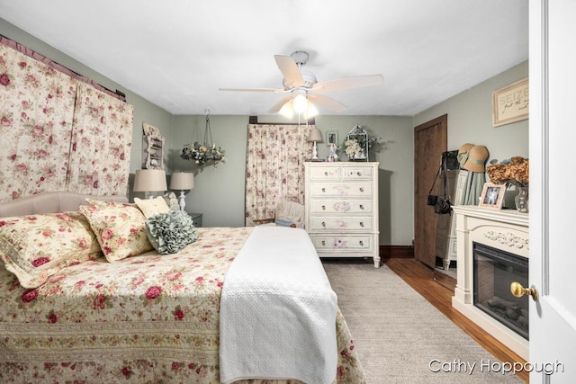 bedroom featuring ceiling fan and wood-type flooring