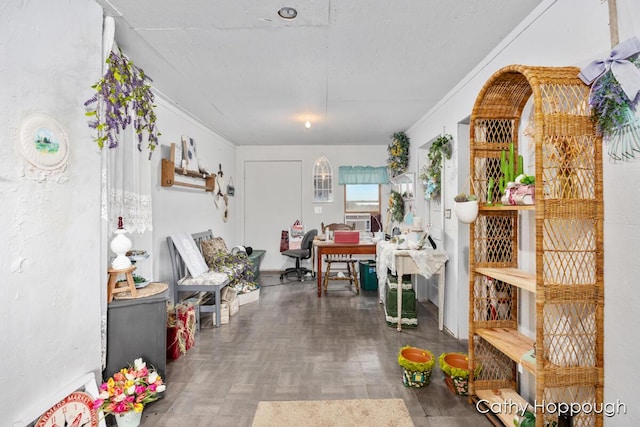 interior space featuring cooling unit, dark parquet flooring, and ornamental molding