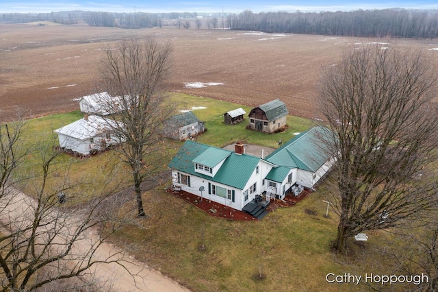 birds eye view of property with a rural view