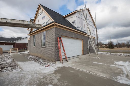 view of side of home featuring a garage